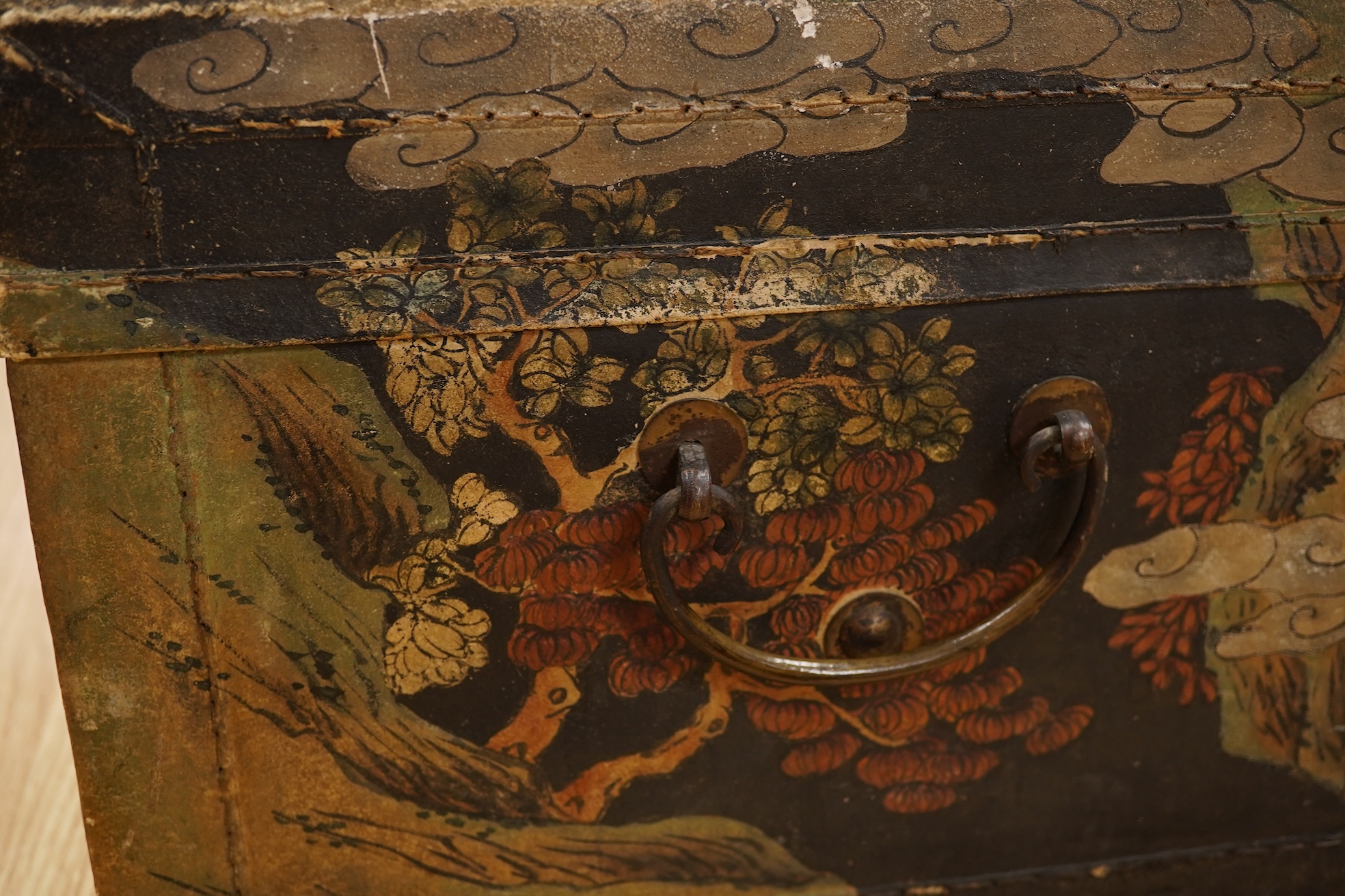 Two Chinese polychrome decorated hide chests, largest 56cm wide